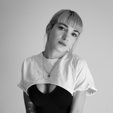 Melek Taştekin, founder and tattoo artist at MT Tattoo Collective, black and white portrait