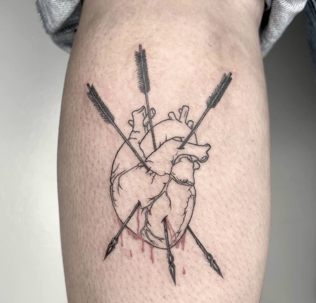 Minimalist heart with arrows fine line tattoo