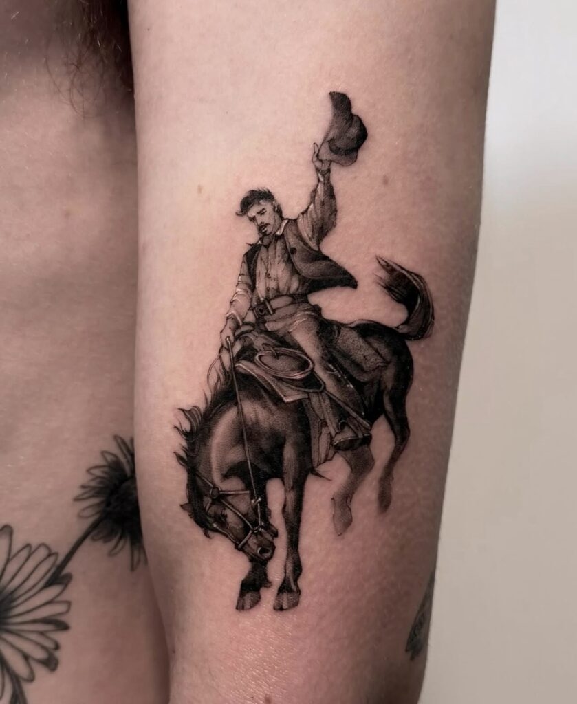 Micro-realism cowboy on horseback fine line tattoo