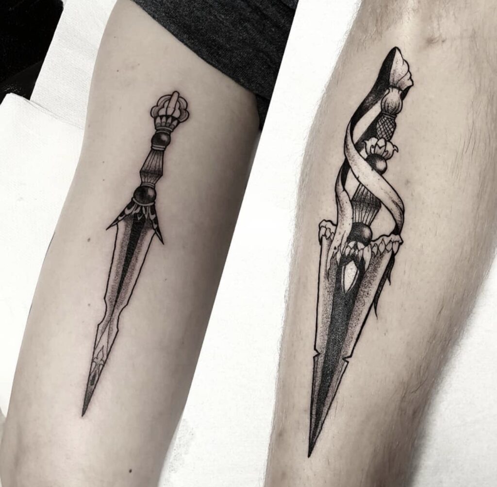 Matching fine line dagger tattoos