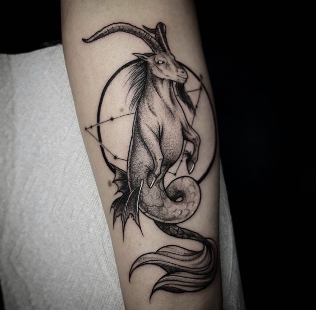 Fine line capricorn zodiac tattoo with geometric elements