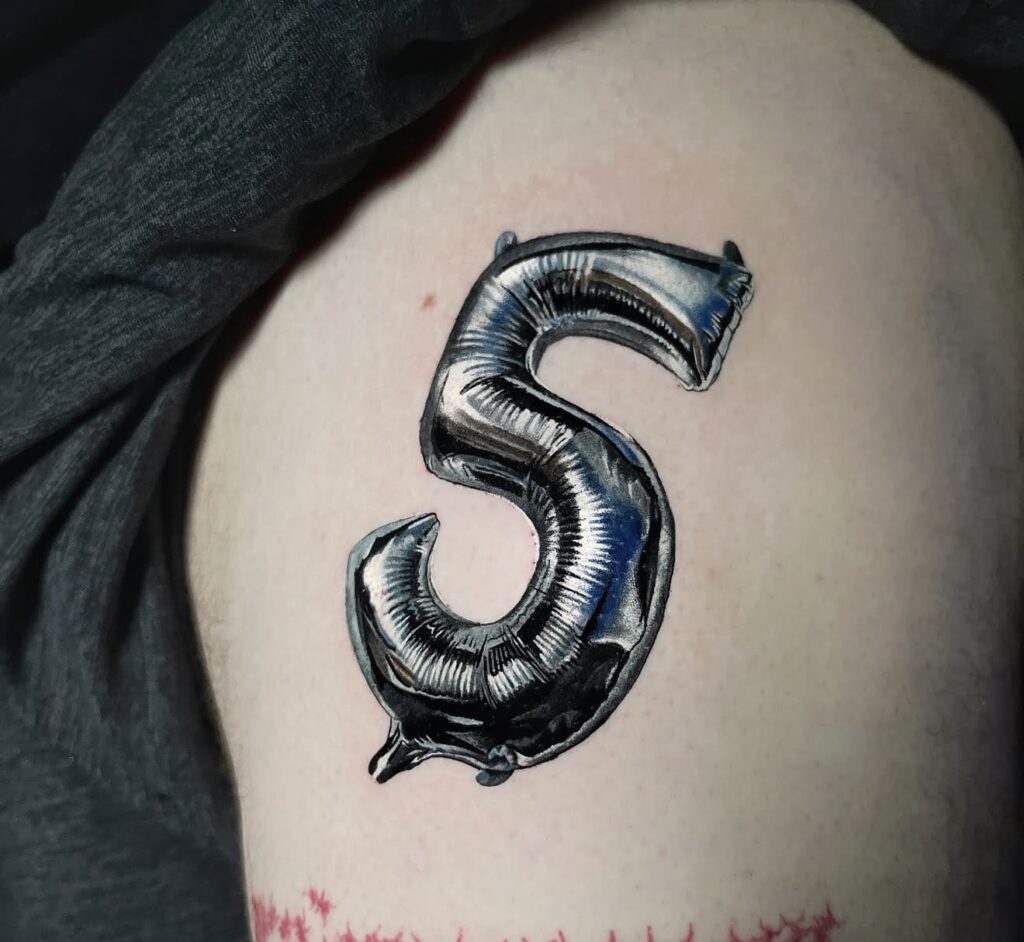 Black and grey realism metallic balloon number 5 tattoo